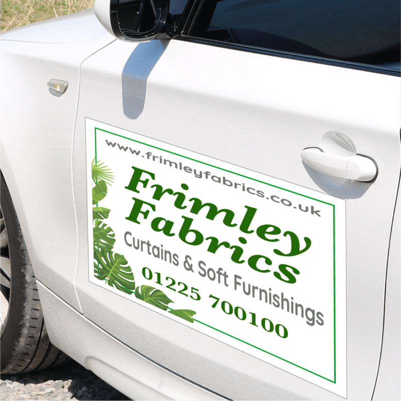 magnetic car sign on car door showing company name, logo and contact details